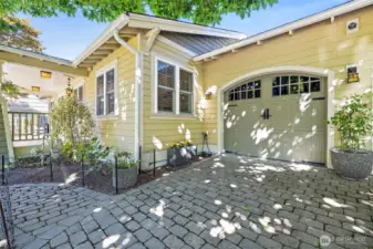 Brick paver driveway offers excellent curb appeal with rich texture.