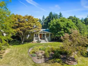 This delightful home is tucked away in a lush green backdrop.