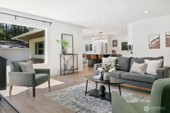 View from main living room to kitchen dining area. You will love the abundance of natural light.
