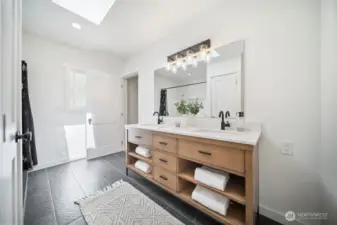 Primary ensuite featuring lovely slate flooring.