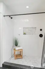Primary ensuite tastefully tiled shower.