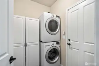 Laundry room with storage.