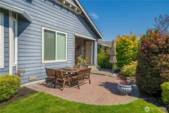 The huge, covered patio with floor to ceiling stone fireplace and motorized privacy screens lead out to the expanded hardscape and mature plantings make this outdoor space a place you will want to enjoy!