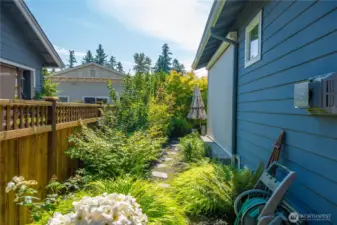 Low maintenance side yard and one of the two motorized privacy screens pictured.