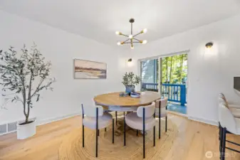 Open main level with gas fireplace, half bath, and covered porch.