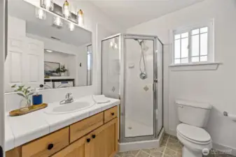 Lower level 3/4 bathroom with laundry