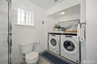 Lower level 3/4 bathroom with laundry