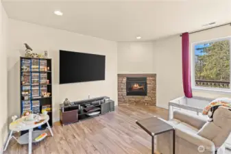 Family room off of kitchen with cozy fireplace!  In the process of moving!