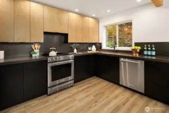 New custom cabinets offer tons of storage.   Sleek porcelain counterops