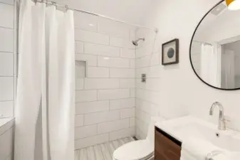 Primary bathroom has undergone a polished remodel