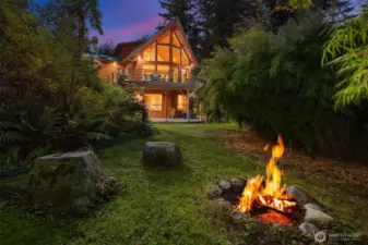 Fire pit by pathway to sauna