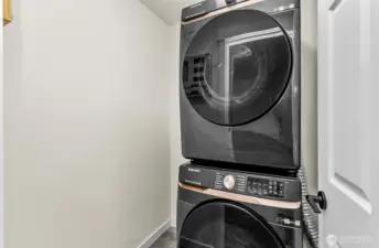 Nice new stackable large washer and dryer with plenty of room to add items you need in the laundry space