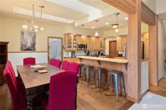 Dining area accommodates a large table and sits adjacent to the eat-in kitchen.