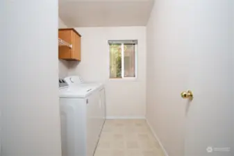 Large laundry room with more storage.