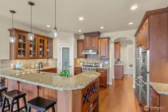 The kitchen is well appointed and includes added banks of cabinets in the hallway and butlers pantry.  Together with the walk in pantry there is more than enough space and room to display your favorite pieces.