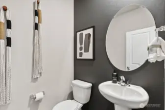 Cute powder room just beyond the foyer. Colors and options will vary. Photos from Model Home on 31. Homesite 45 is a mirror image.