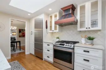 Gas stove with custom vent hood. Check out the skylight!