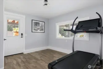 Rec room on lower level w/ exterior access (being used as a gym).