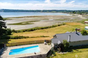 Community clubhouse, heated pool, yard, and beach.
