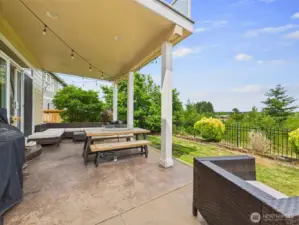 covered backyard patio with stamped concrete