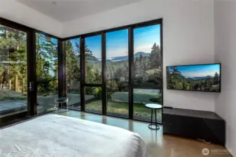 Primary bedroom with breathtaking views to wake up to