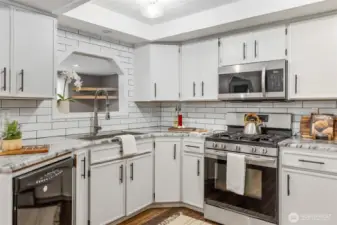 Updated kitchen with farmhouse sink and upgraded appliances - all appliances are included with the home
