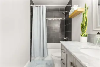 Updated full bathroom with deep tub, tile shower and tile floors