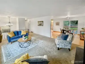 Another view of living area shows access to dining and kitchen.