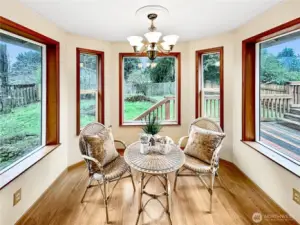 Charming bay window nook off kitchen over looks rear yard.  The perfect place for morning coffee.