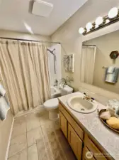 Main floor full bathroom. Tile floors and updated tile tub/shower surround.