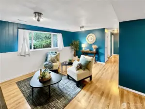 Rec room from garage entrance, hallway leads to laundry/pantry offering tons of storage.  3/4 bath and 2 bedrooms, stairs to left lead to upper floor.