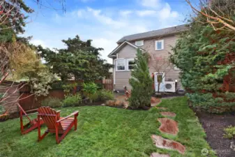 Outlook toward the back of house from the lovely, landscaped backyard.