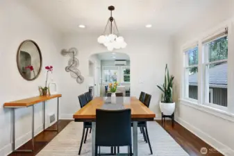 Spacious formal dining room with hardwoods, coved ceiling and leaded glass windows.
