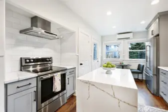 Doors to finished lower level and to backyard off kitchen.