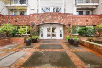 The unit is part of the Ballard condominiums, which offers an impressive amenity package including 7 day a week concierge, outdoor pool, hot tub, sauna, gym, clubhouse, business center, BBQ, patio, and rooftop deck. This is a shot of the front of the main building, which is located two doors west of the unit located at 1519 NW. 57th St.