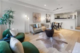 Upon entry, you'll notice just how light and bright this unit is.  At more than 1,000 square feet, this is one of the largest 1-bedroom units in the building and one of only a handful of coveted street-level homes that also has an extra ½ bath which is to the right of the kitchen in the background of this photo