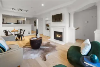 Front door is to the right of the green chair, and you can also  see a portion of the handrail that leads down to the bedroom, office/flex space and full bath. But let's continue our tour upstairs first.