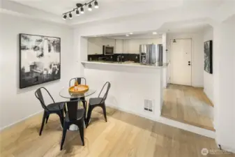 Talk about convenience…enjoy rare direct access to your home from either the street, or the secure gated garage (door shown in the photo) with your private parking space just outside your back/kitchen door—making groceries, pets, and everyday living incredibly easy.