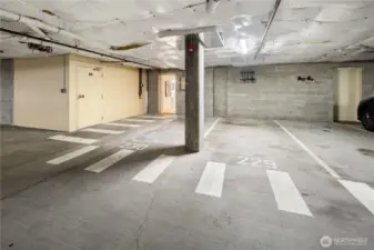 Here's your spot, number 229, and you can see the open door to the left of the spot which allows you to walk directly into your unit. Super convenient and within a secure parking garage