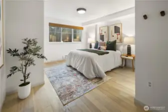 We have now walked into the primary bedroom. Yes that's a king size bed and you can see just how much more room there still is.