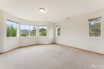 Extra large Primary Bedroom lot of natural light and view of the park.