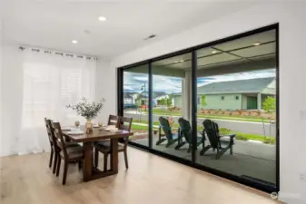 Spacious dining area with a wall of Multi-slide doors to let the outdoors in on those warm summer evenings.