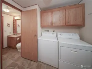 Laundry room area, Hall bathroom shown