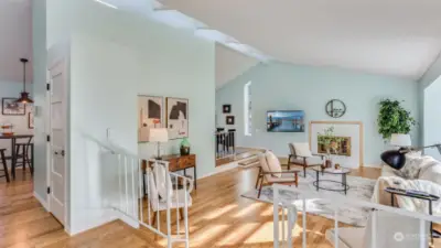 In this view, natural light fills the living room, creating a bright and inviting atmosphere.