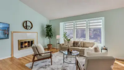 Wall of windows bath this living room in natural light really highlighting the natural beauty of the bamboo floors.