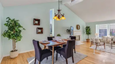 A view of the dining room with a clear sightline to the living room, ensuring easy access between spaces