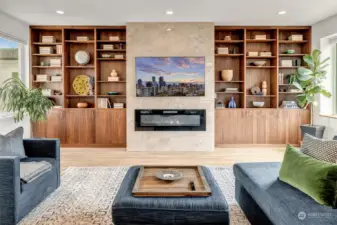 Custom built-in walnut bookshelves and cabinets complete the great room.