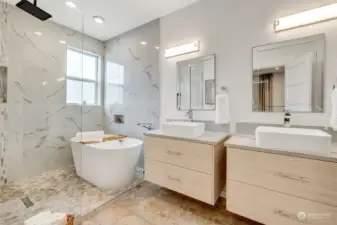 Double vanity with storage, check out the soaking tub!