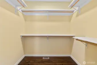 Ample walk-in closet offers plenty of room for clothes and accessories.