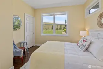 Bright and airy guest bedroom with plenty of space for rest and relaxation. Perfect for family visits or a home office.